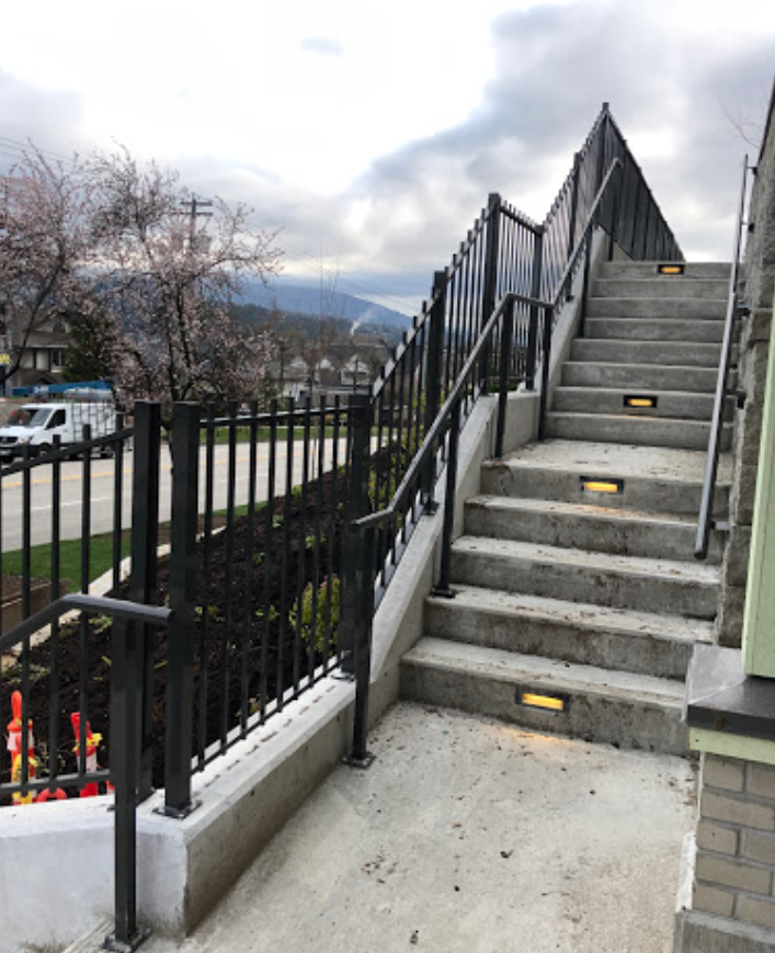 picket railings and aluminum stairs black